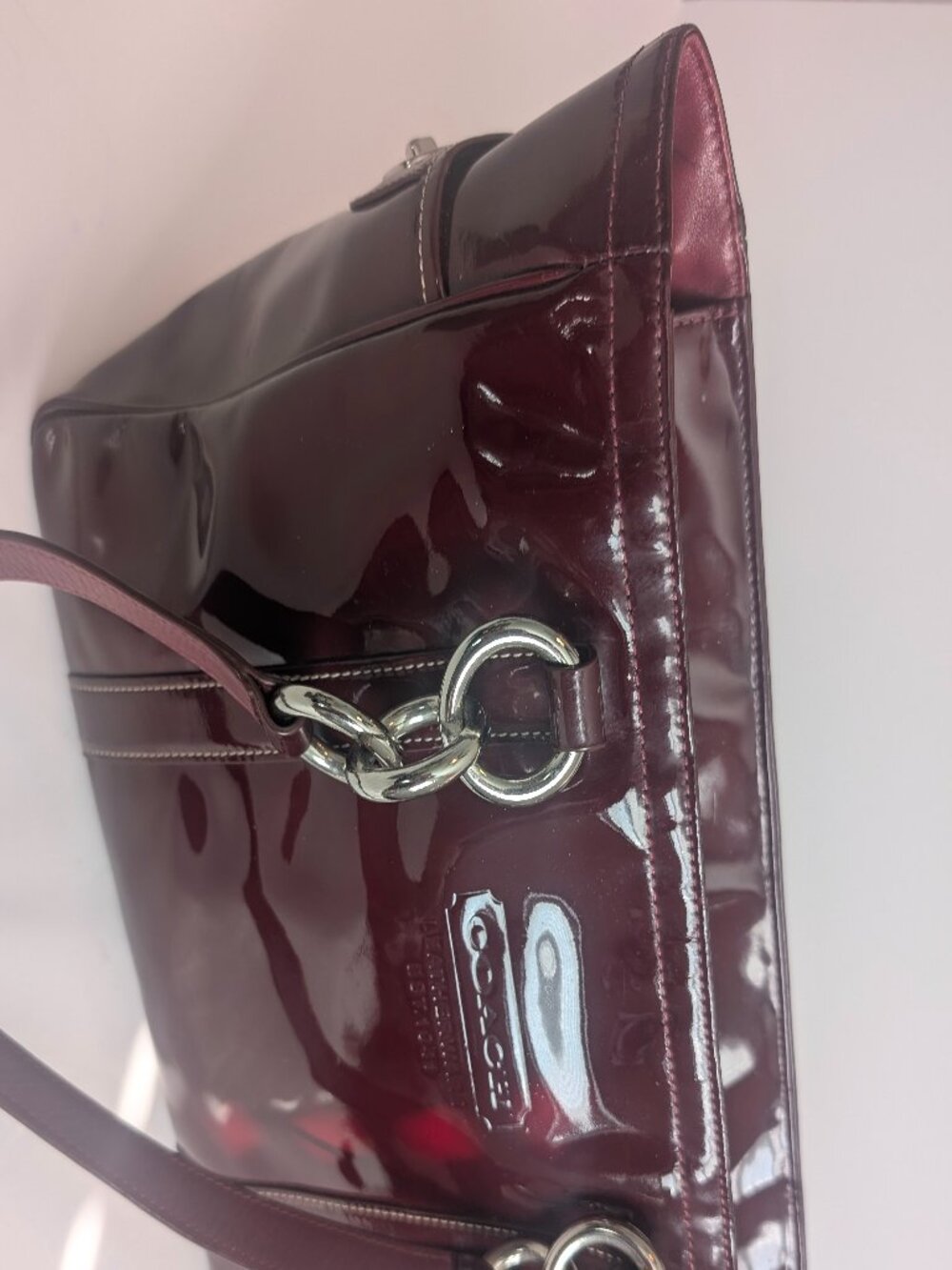 Coach Plum/Burgundy patent leather handbag